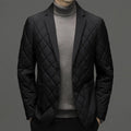 Man wearing a solid colour thick lapel down jacket with side seam pockets.
