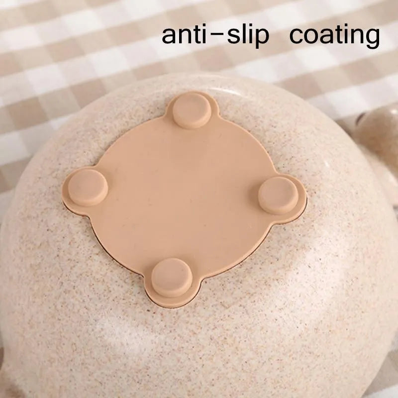 Cute tiny dinosaur bowl made of natural wheat straw fibre in pink, green, and beige colours, lightweight non-slip unbreakable design