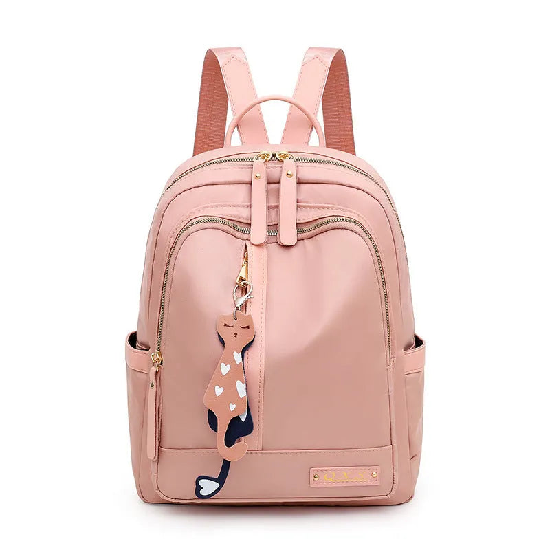 Soft black nylon women's casual backpack with double straps, external pocket, and internal organisers.