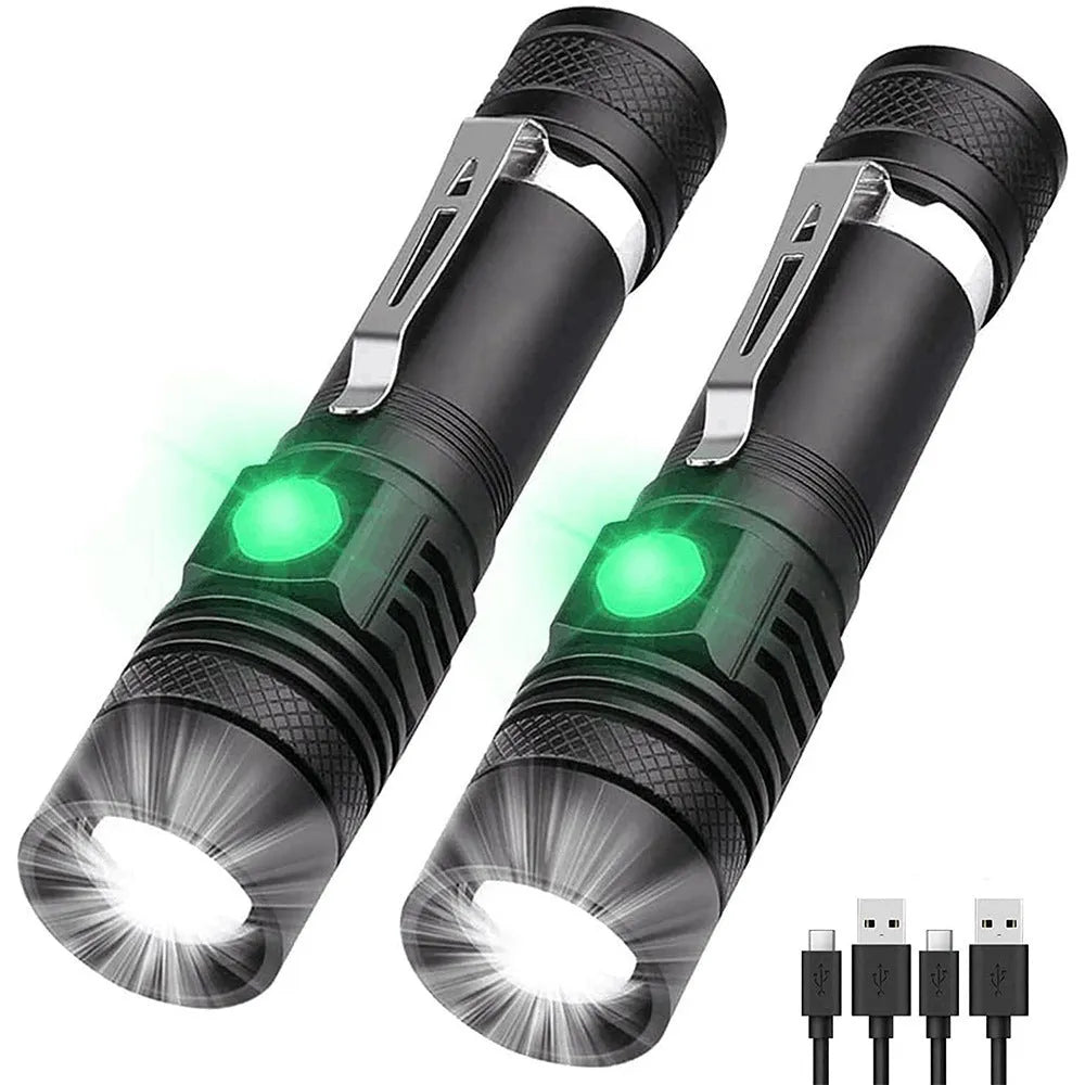 Black telescopic zoom USB rechargeable T6 LED flashlight on outdoor background