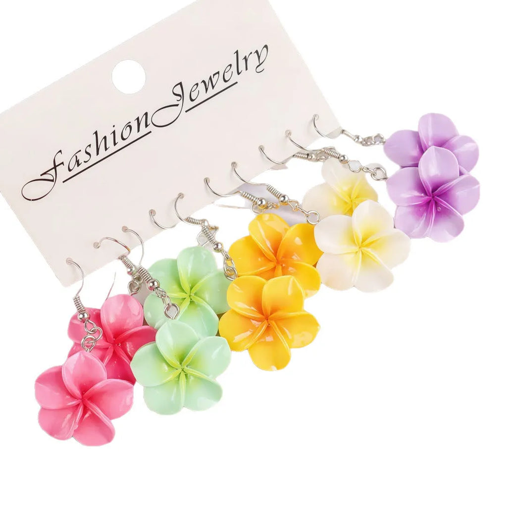 Handmade resin Plumeria Rubra earrings in seven colours including pink, blue, purple, white, green, yellow, and rose red