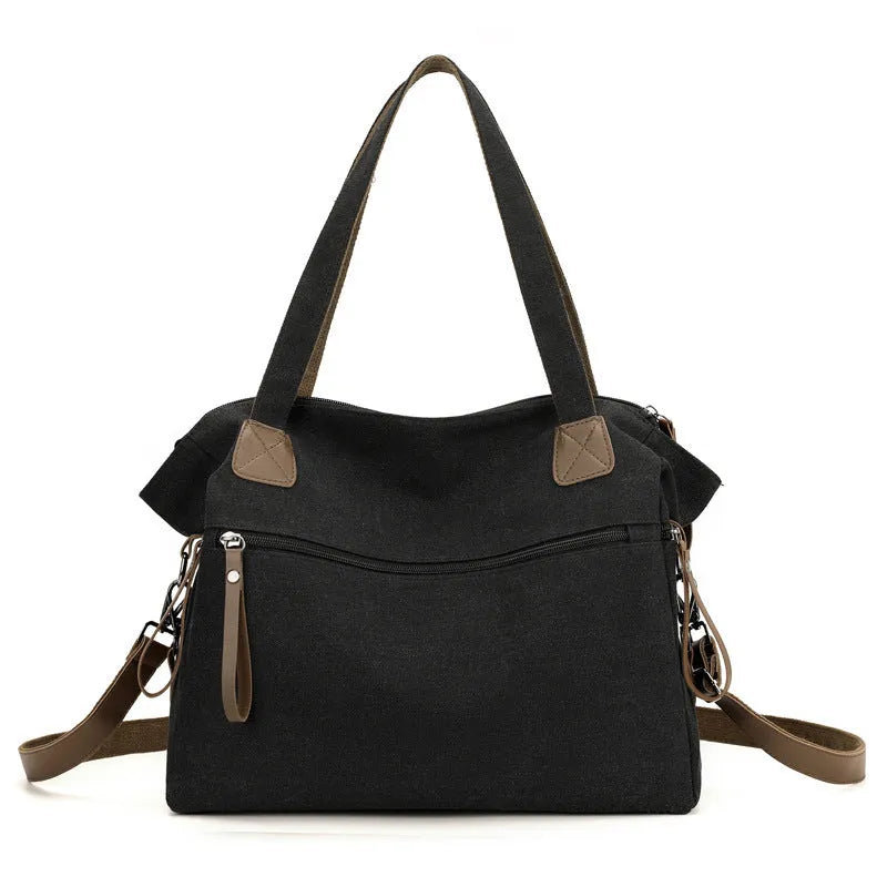 Women's retro style canvas shoulder bag in horizontal square shape with organisational compartments