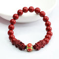 Close-up of a purple gold sand Cinnabar bracelet with carved Double Pixiu design, bead size 8mm.