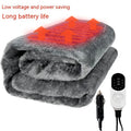Grey 12v car electric blanket with power cord and controller on a car seat.