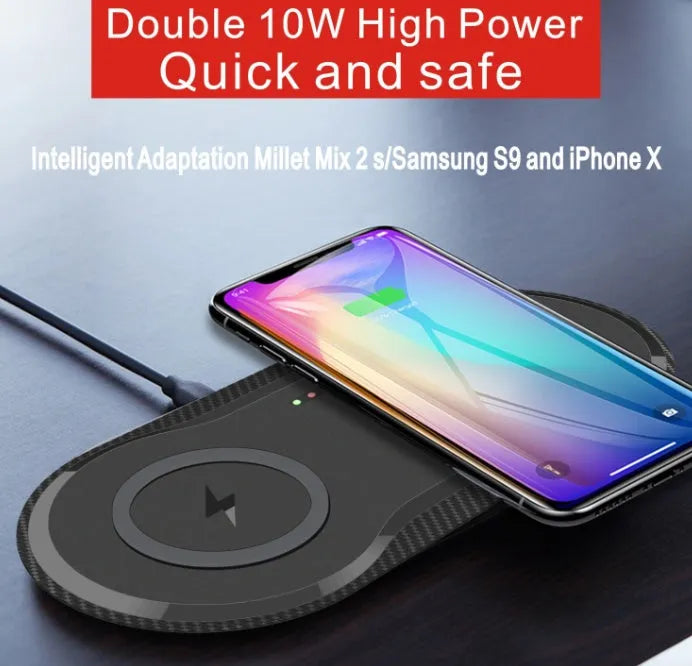 Black and white dual wireless charging pad charging two smartphones simultaneously