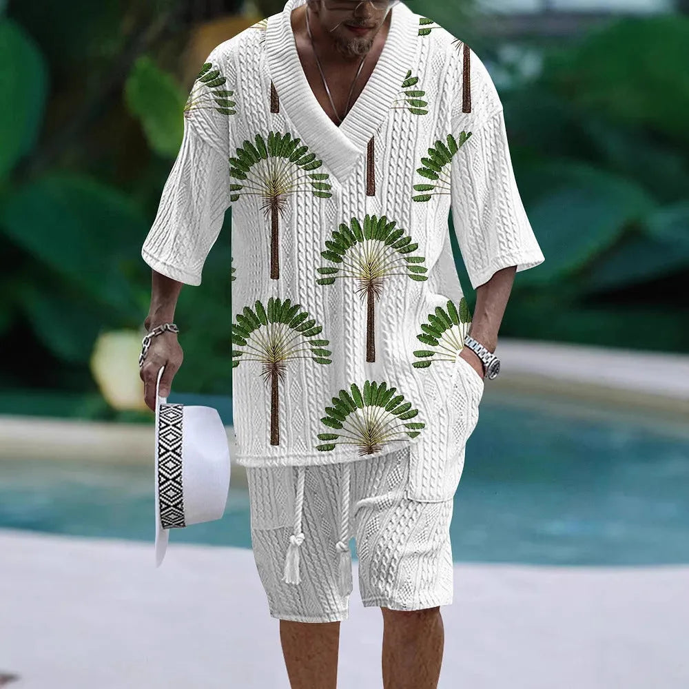 A man's loose-fitting casual short sleeve suit in a solid colour, featuring a short-sleeve top and matching shorts.