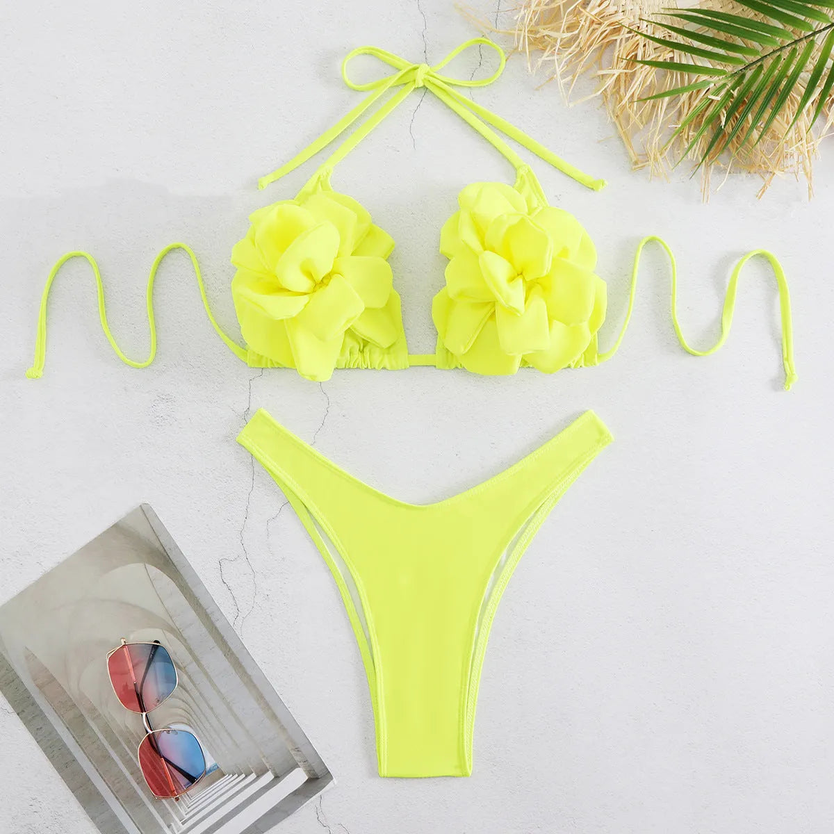 Three-dimensional 3D flower pattern on low waist bikini swimsuit in solid colour