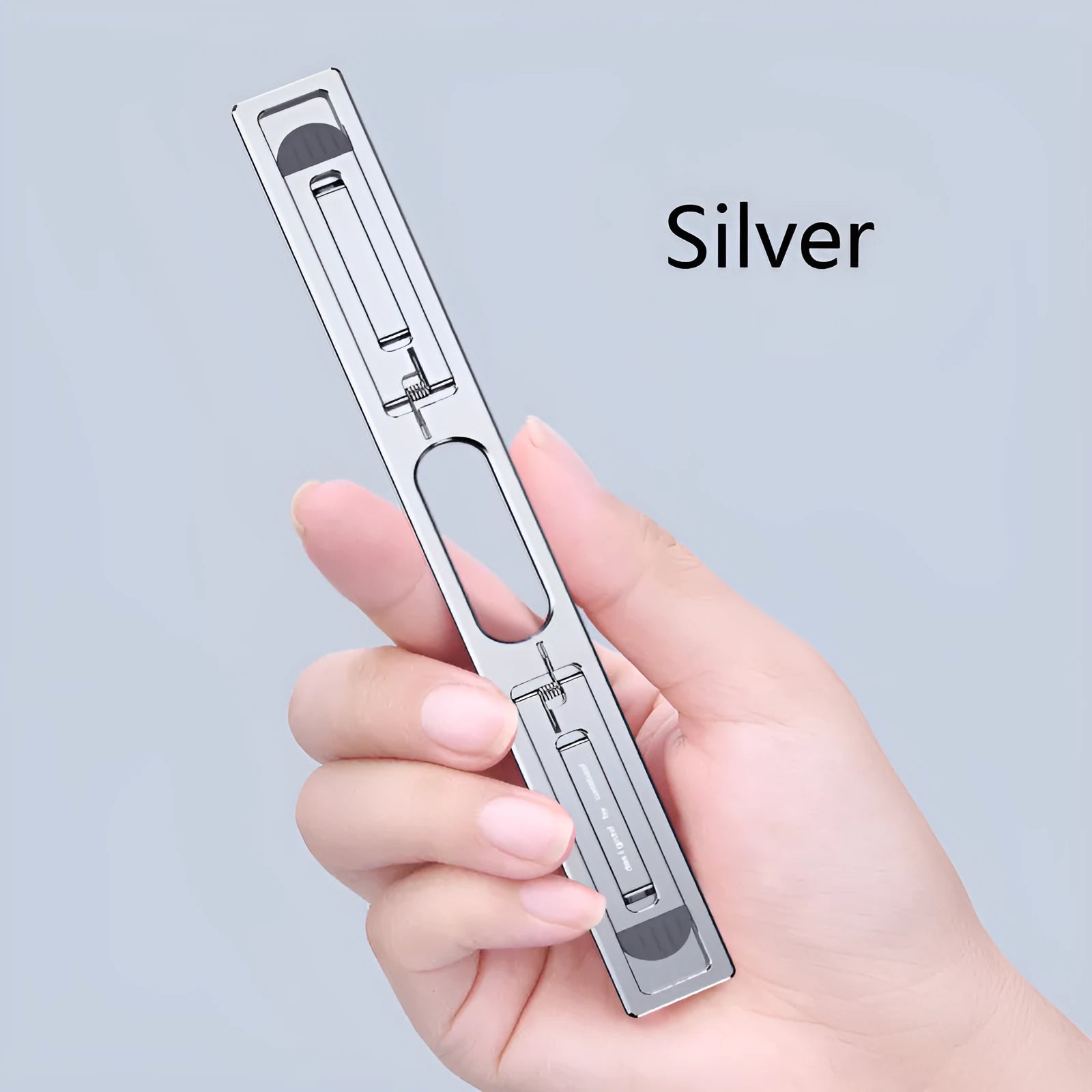 Aluminium alloy adjustable laptop cooling bracket stand in silver colour on a desktop