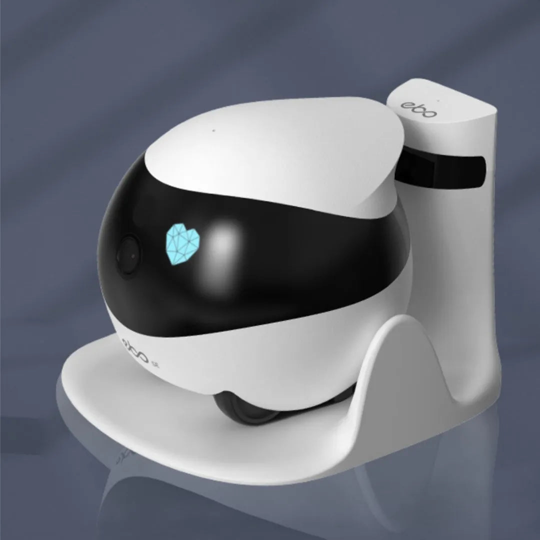 White smart home mobile surveillance robot camera on charging dock