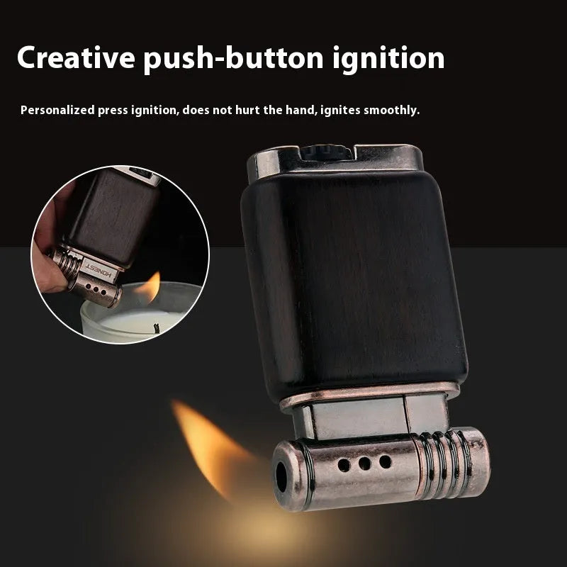 Decorative rosewood and blackwood gas lighter with sun face engraving on metal body.
