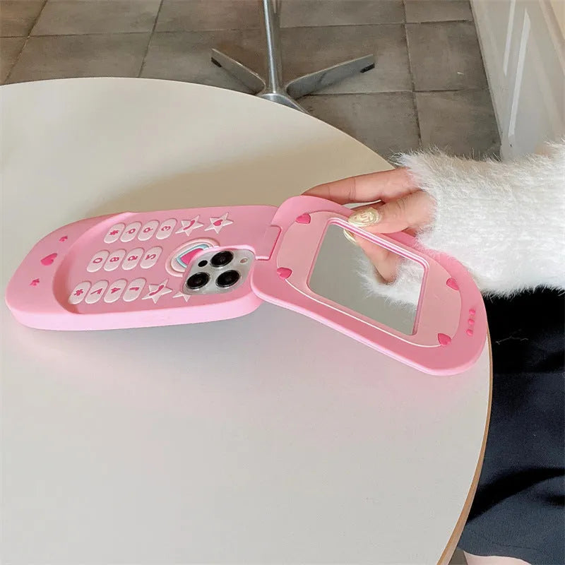 Pink silicone flip phone case with mirror for iPhone models.