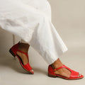 Red women's plus size sandals with square buckle straps and a herringbone toe holder.