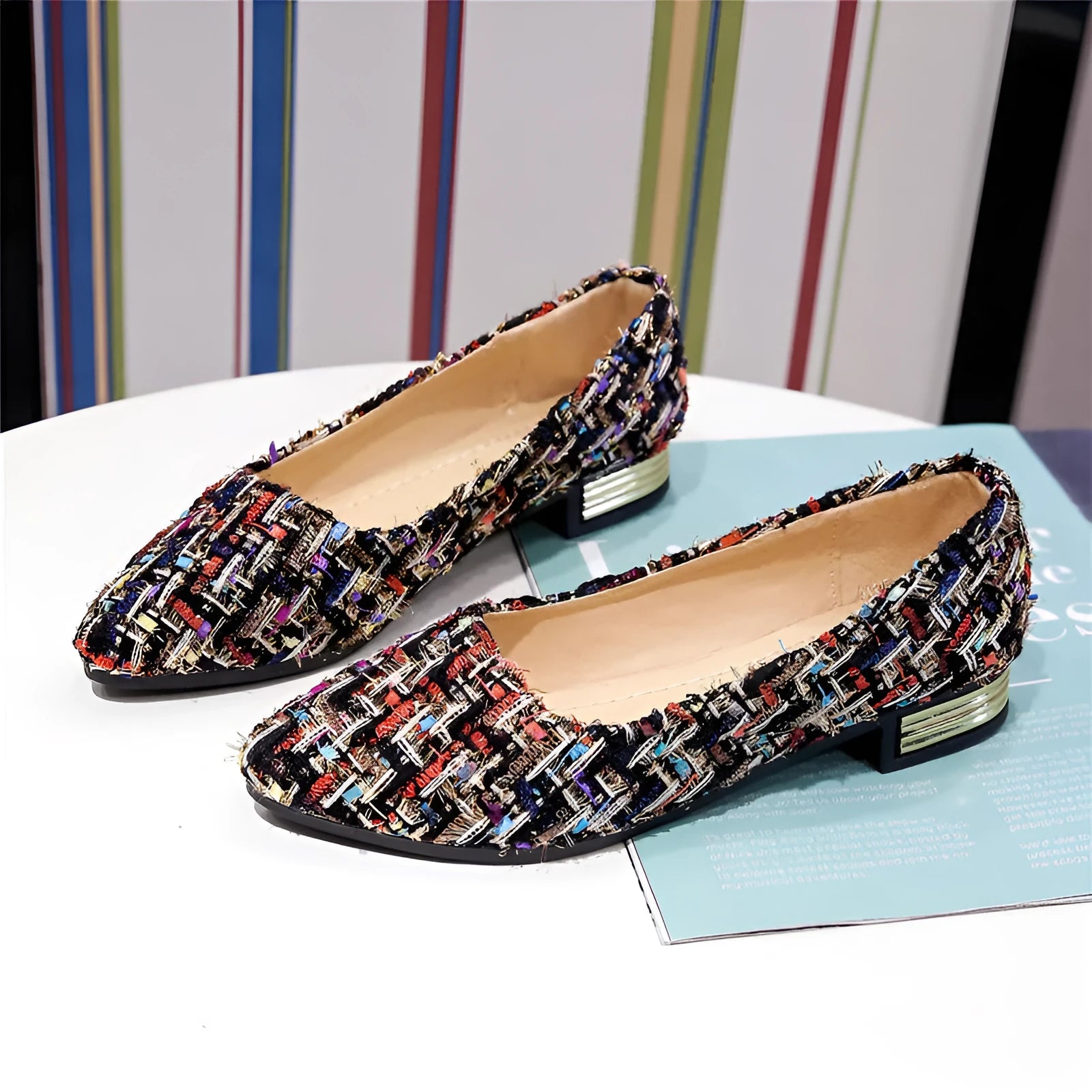 Women's black canvas casual flats with pointed toe and low-cut design on flat rubber sole