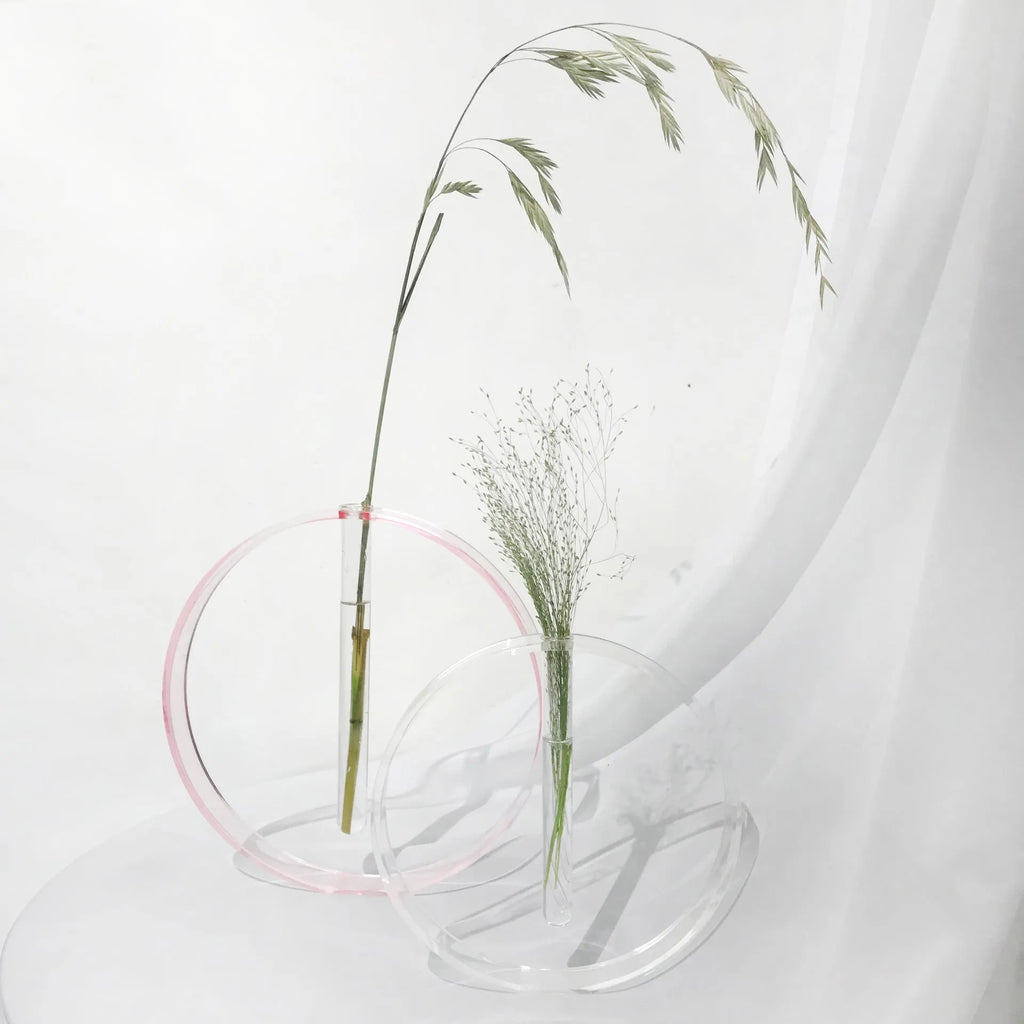 Handmade acrylic test tube vase with polished surface, shown in pink or transparent, small or large size options.