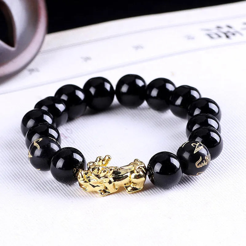 Imitation obsidian bracelet with 18K gold, little pearl and six brave words on hand