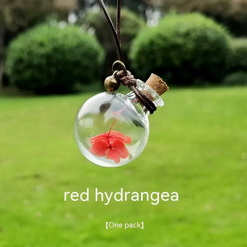 Glass car perfume pendant with preserved flowers for interior decoration and air freshening