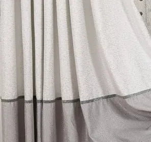 Blackout curtain panel showing light-blocking fabric, available in multiple widths with hook or rings for hanging.
