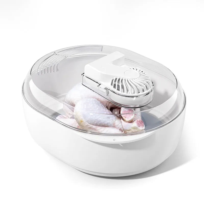 Modern aluminium kitchen defrosting plate on a countertop, shown next to frozen food.