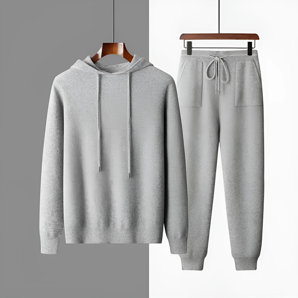 Men's light gray cashmere blend hoodie and matching long pants set on a hanger.
