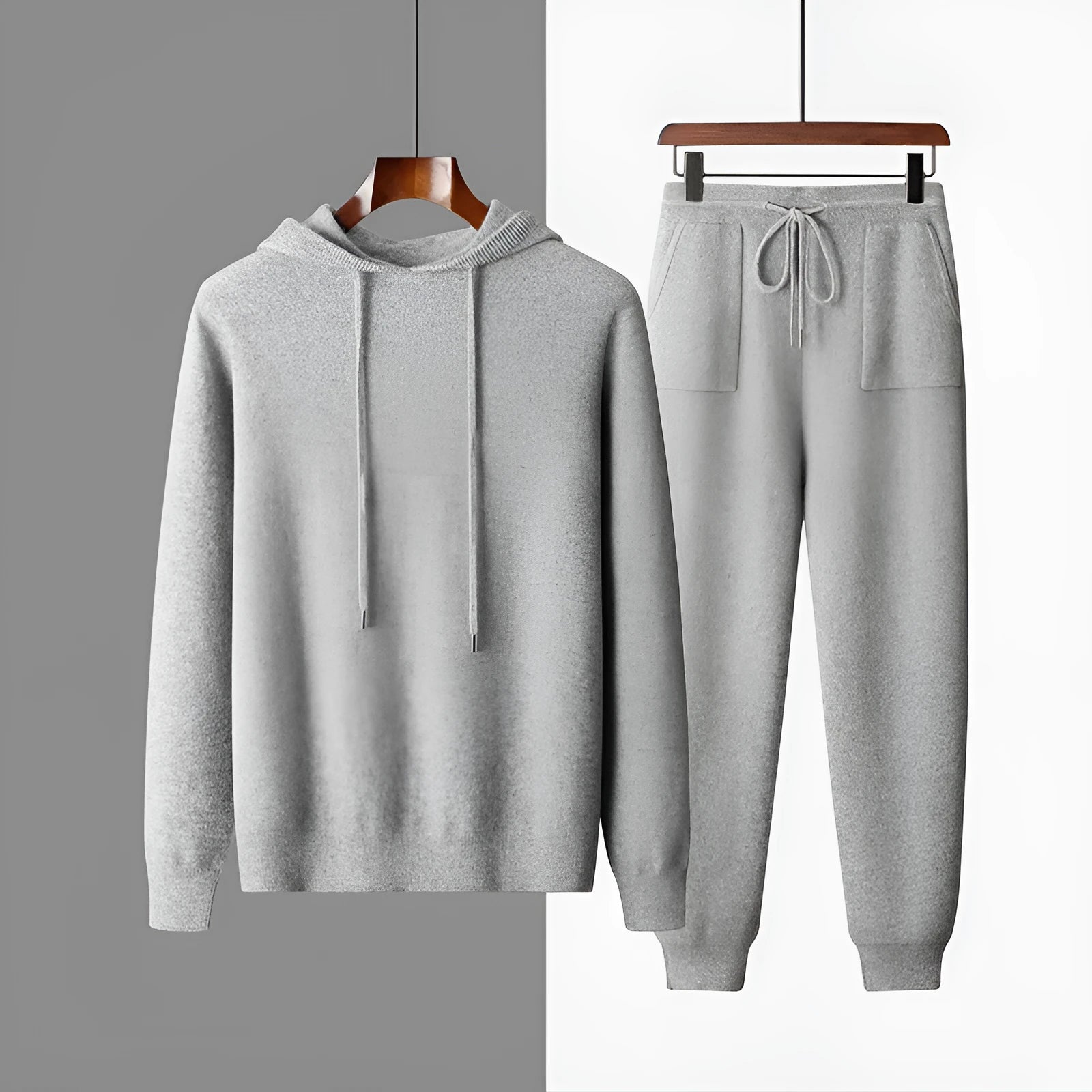 Men's light gray cashmere blend hoodie and matching long pants set on a hanger.
