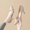 Women's gold stiletto court shoes with pointed toe and 9cm heel on white background