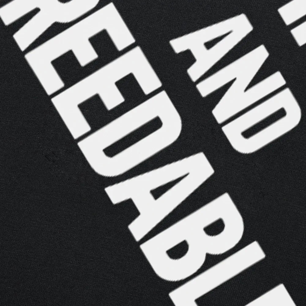Funny Obedient And Reproducible text printed on a loose fit black cotton t-shirt.