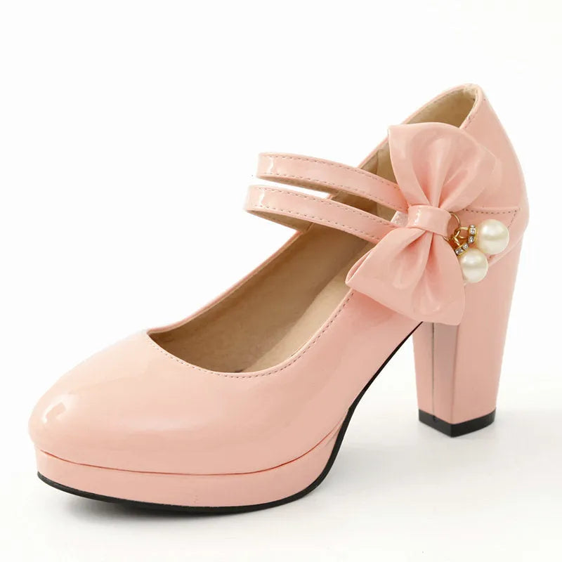 Women's waterproof platform shoes with chunky heels in red colour with round toe and buckle closure
