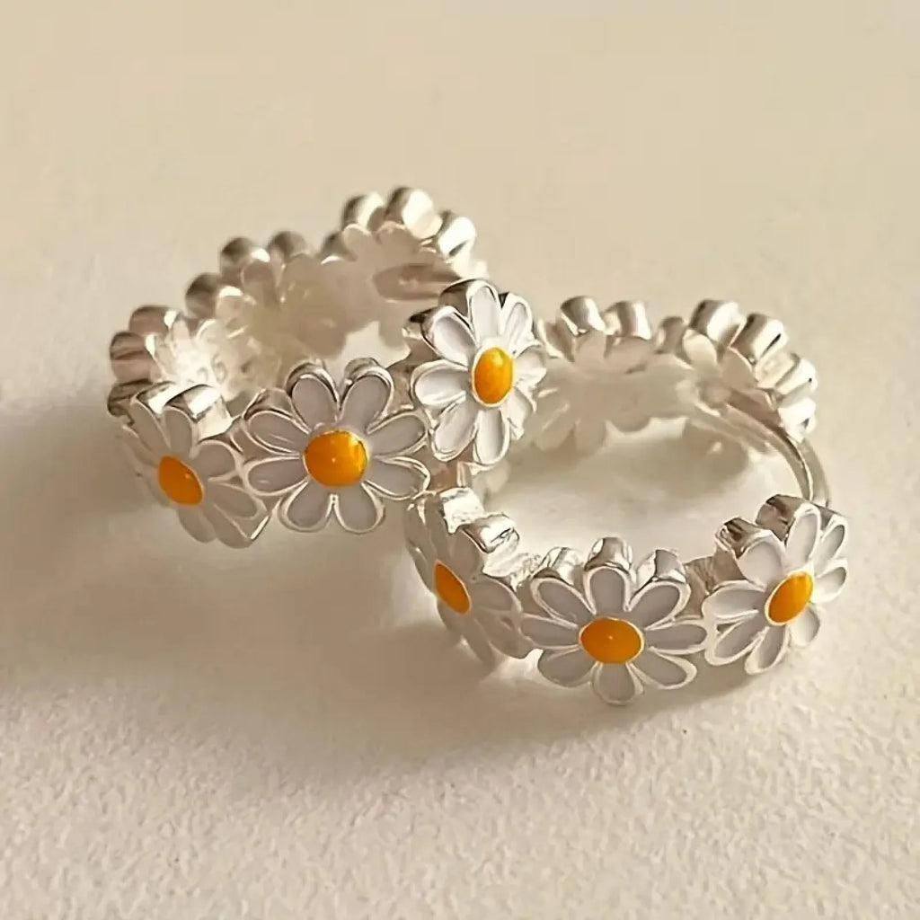 White daisy flower fashion ring earrings with electroplated finish and gemstone details.