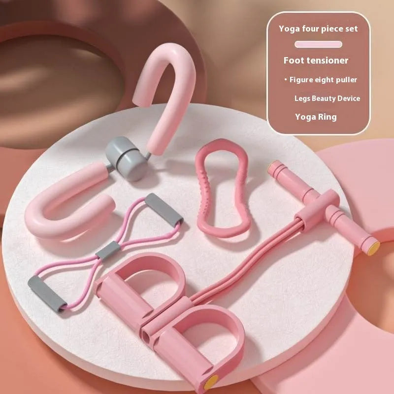 Yoga four piece fitness set with leg stretcher, yoga ring, pedal device, and figure eight tension rope on a plain background