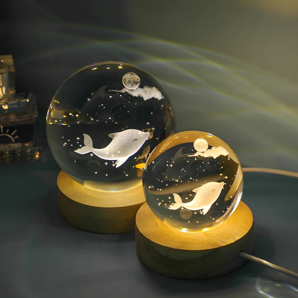 Transparent crystal ball night lamp with 3D carved jellyfish design, on a round base with USB cable.