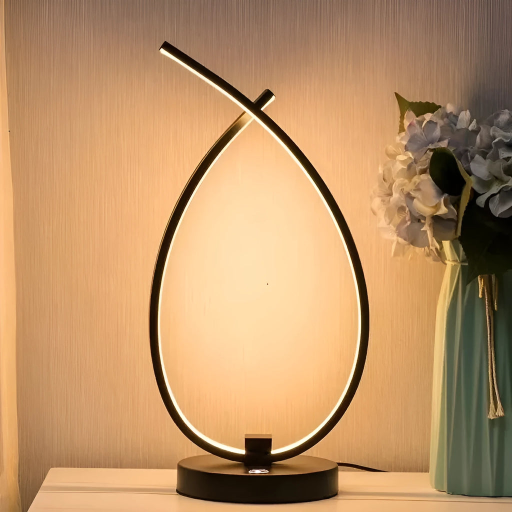 Water drop shaped table lamp in black or white with warm light and USB power