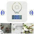 White wireless carbon monoxide alarm mounted on a wall for detecting coal and soot gas.