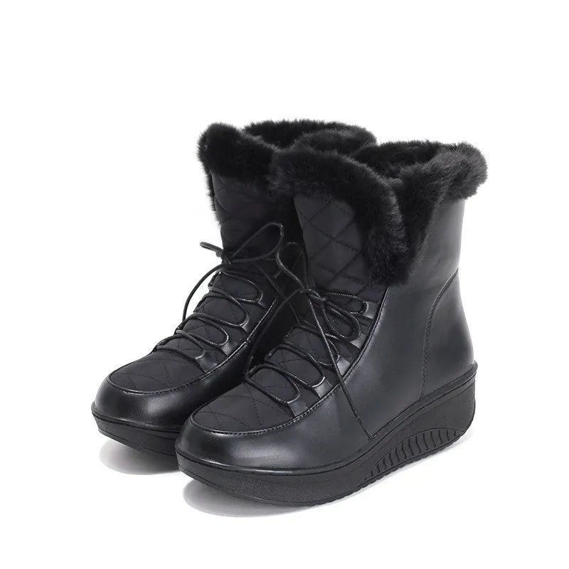 Black women's lace-up winter boots with a platform sole on a neutral background.