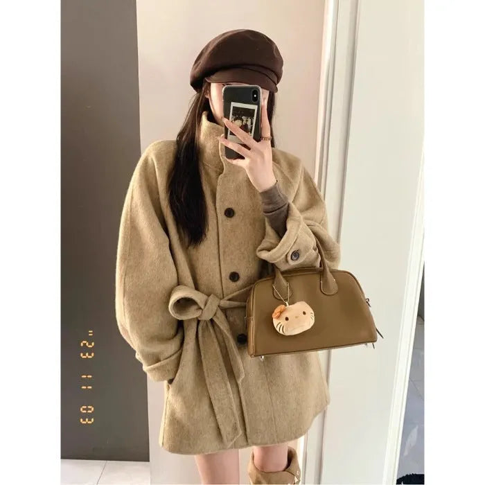 Korean style short woolen coat in black with button front, conventional sleeves, medium thickness, polyester fabric