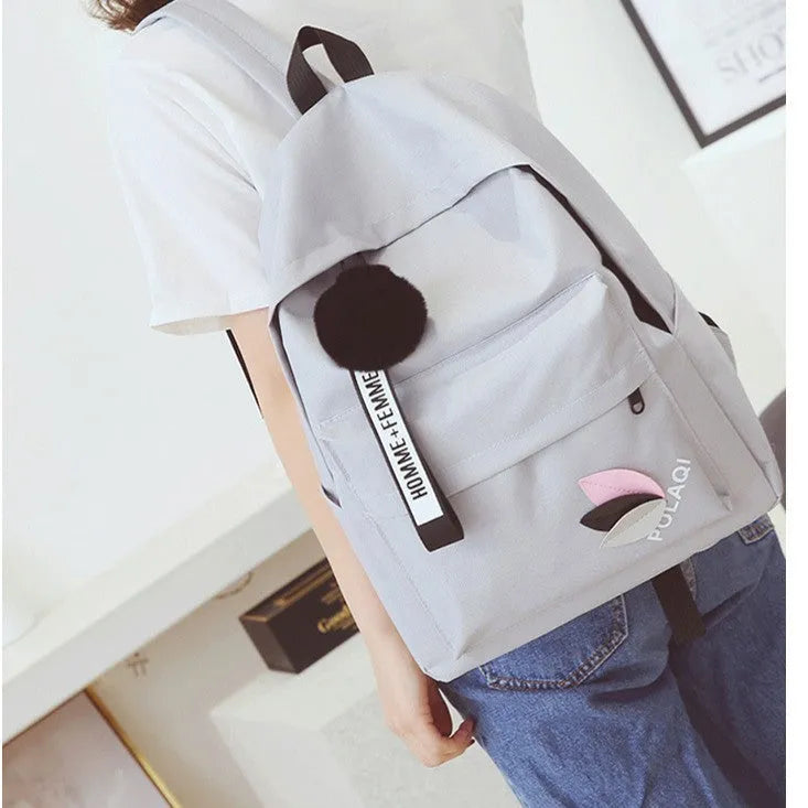 Green canvas college schoolbag with casual styling and anti-theft features