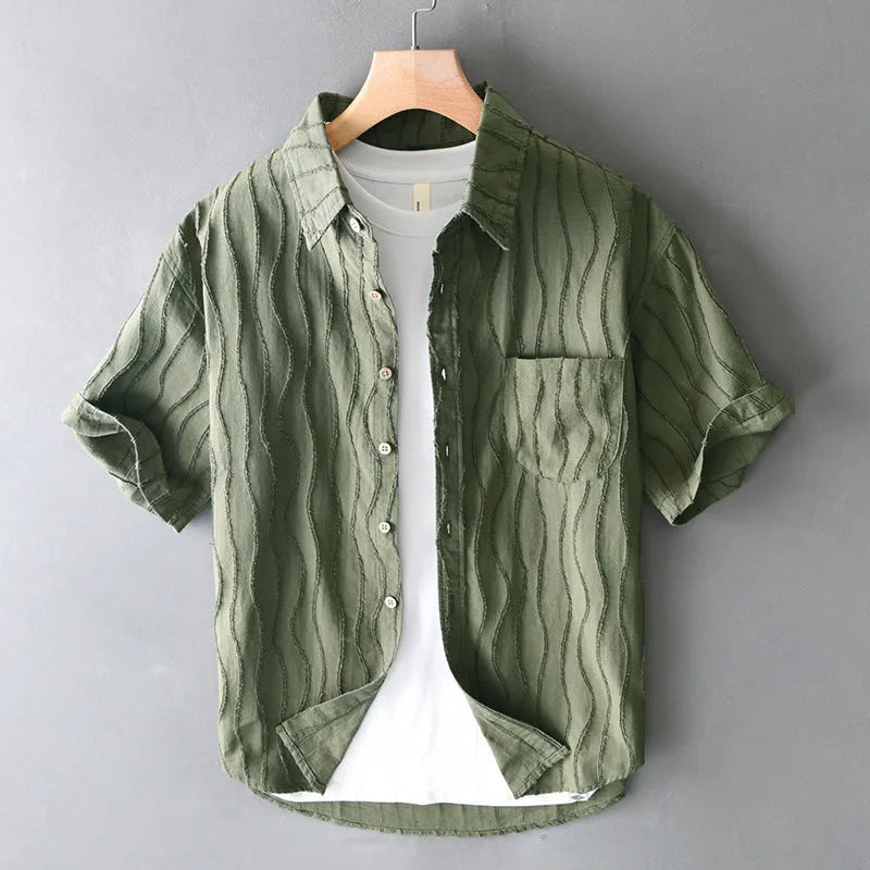 Men's apricot and army green pure cotton short-sleeve casual shirt on a hanger.