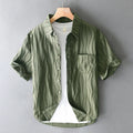 Men's apricot and army green pure cotton short-sleeve casual shirt on a hanger.