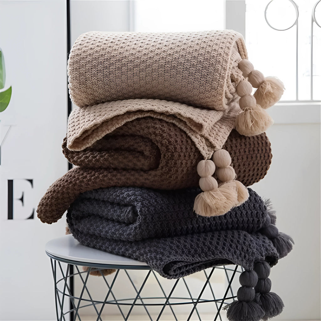 Nordic style fringed knit ball blanket in acrylic fabric, size 130x170cm, shown in beige colour