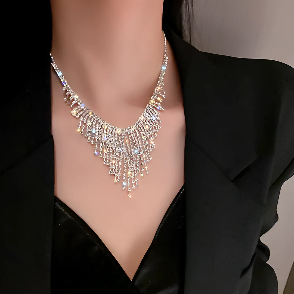 Silver diamond tassel necklace with geometric alloy pendant and ball bead chain on a light background