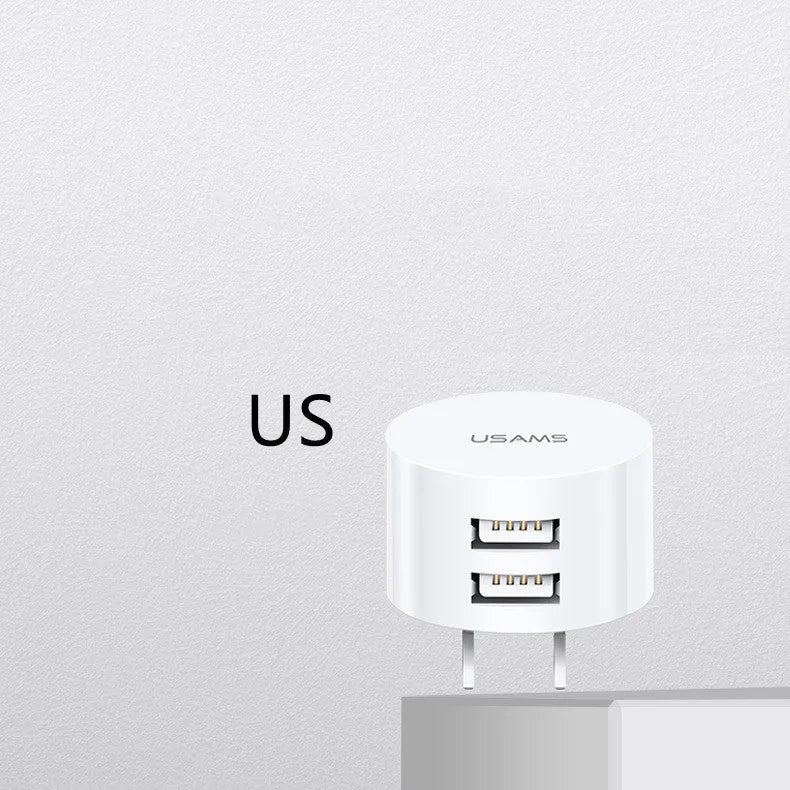 White dual USB phone charger with international plugs for US EU UK regions showing compact 39mm diameter design