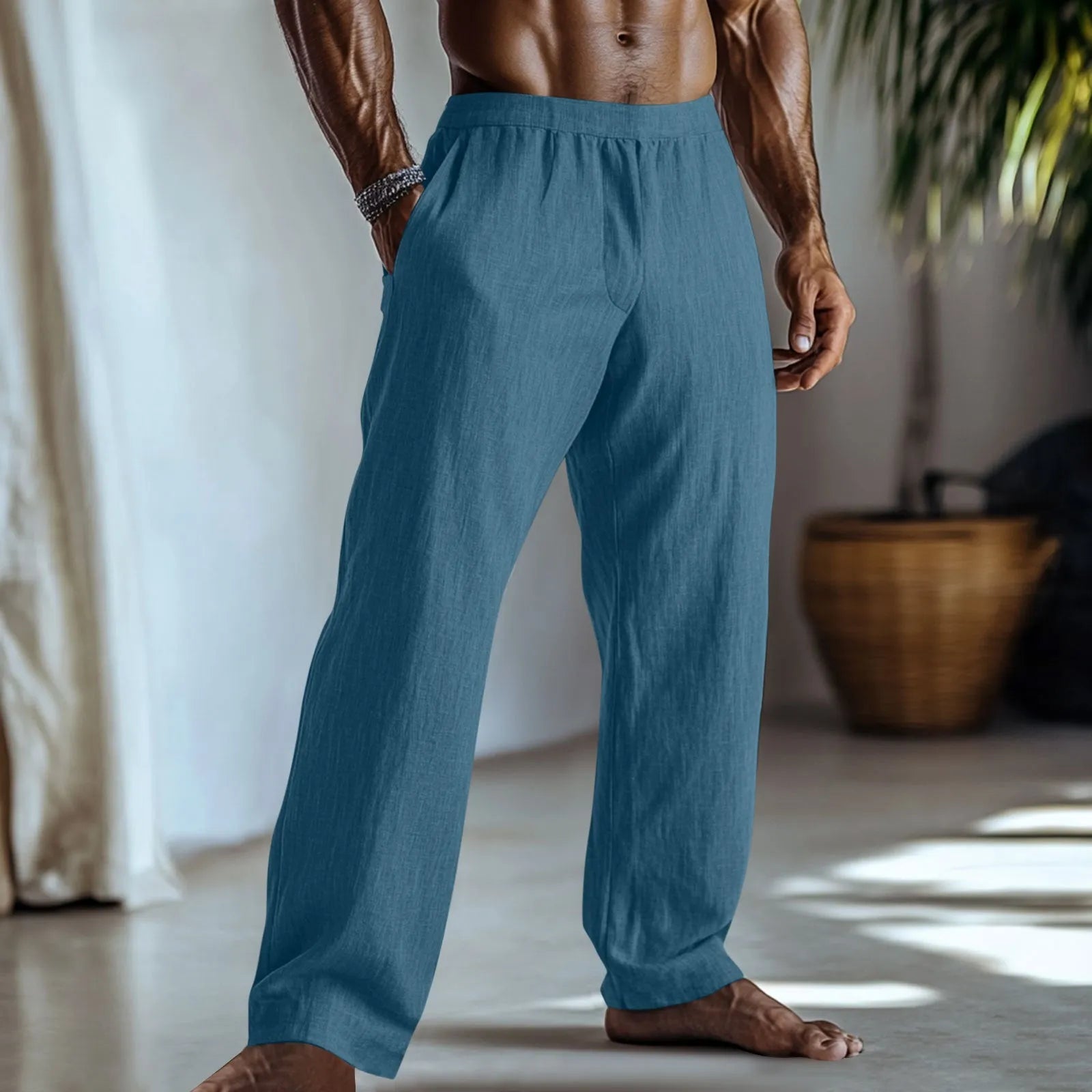 Straight-leg cotton linen trousers in light green on a hanger