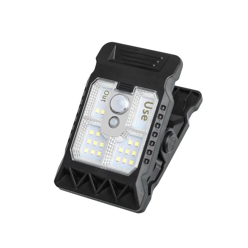 Compact white clip lamp with human body sensor, shown with dimensions 11.2cm by 7.6cm.