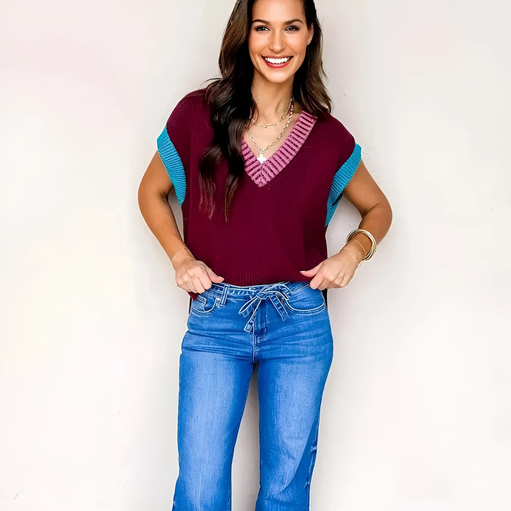 Burgundy loose-fitting V-neck sweater with short cuffed sleeves and contrast trim detail