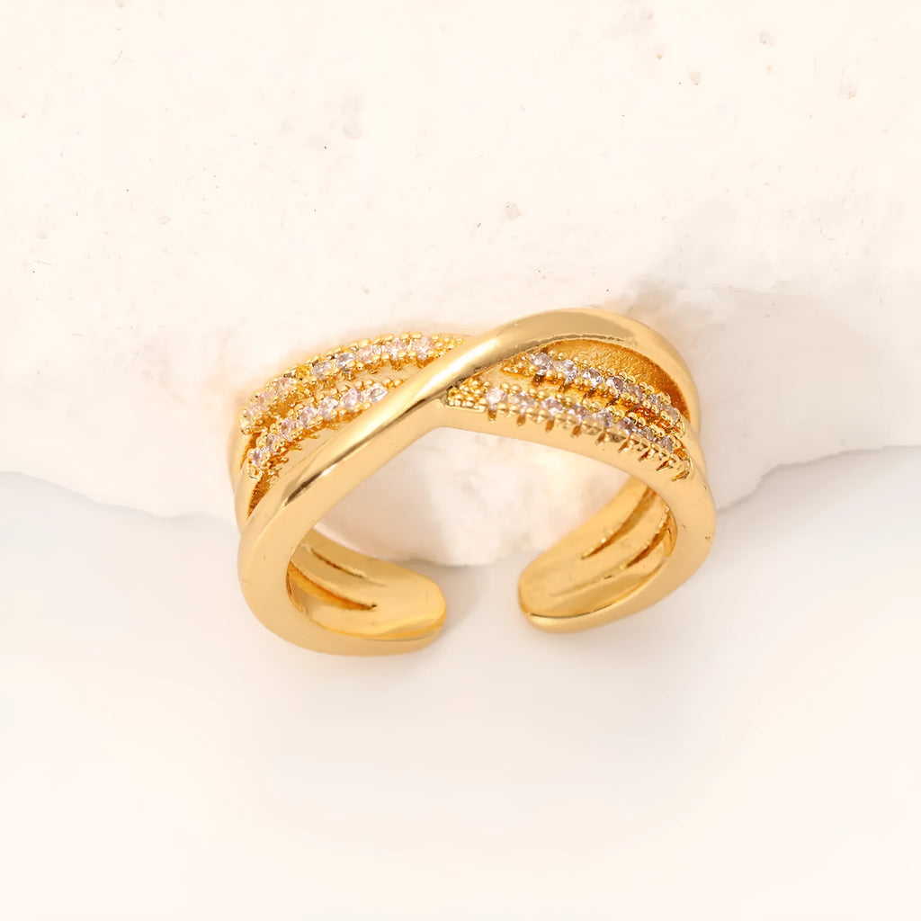 Women's gold open ring with geometric line pattern on copper base
