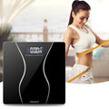 Black digital electronic bathroom scale on a tiled floor, showing digital display.