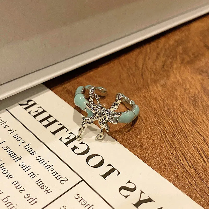 Simple copper women's ring with a Chinese butterfly design, showing an example from the 33 available numbered styles.