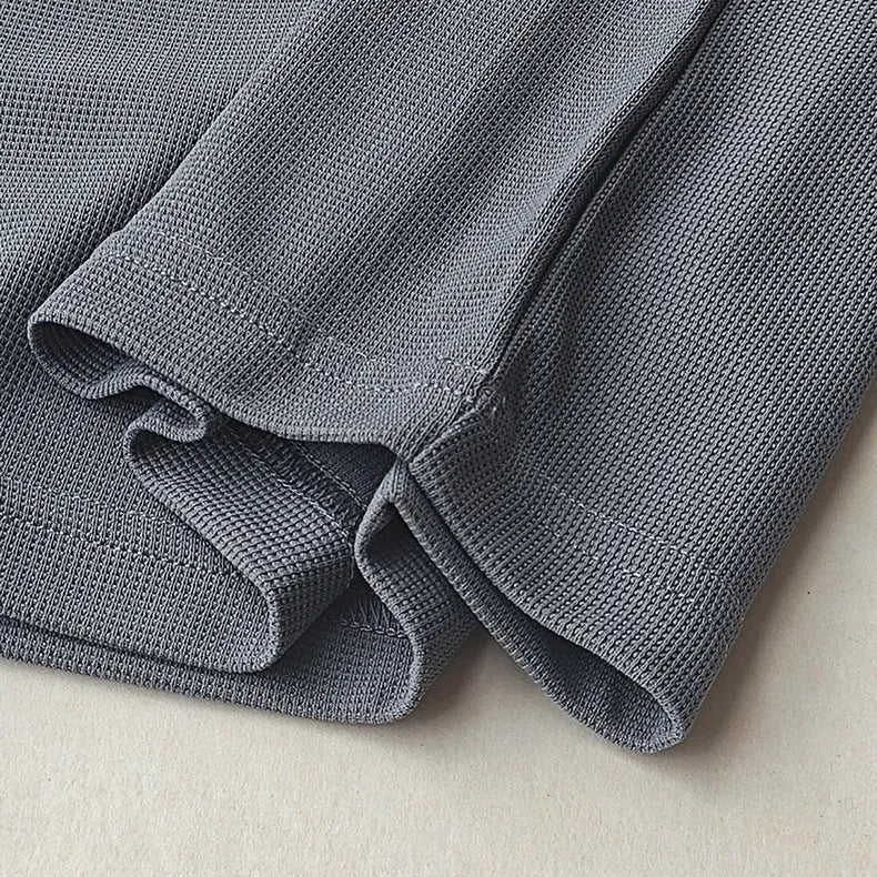 Men's dark grey heavy waffle texture short sleeve t-shirt on a hanger