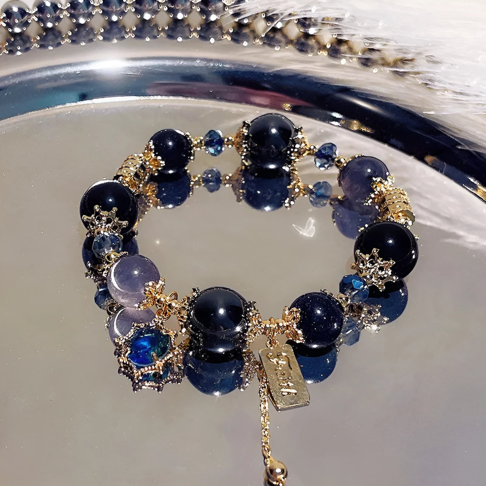 Women's galaxy colour bracelet with snowflake pendant and bow design on heart-shaped alloy base