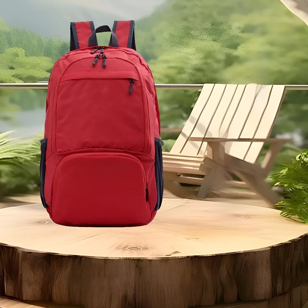 26-inch foldable Oxford cloth backpack shown in brick red colour, laying flat.