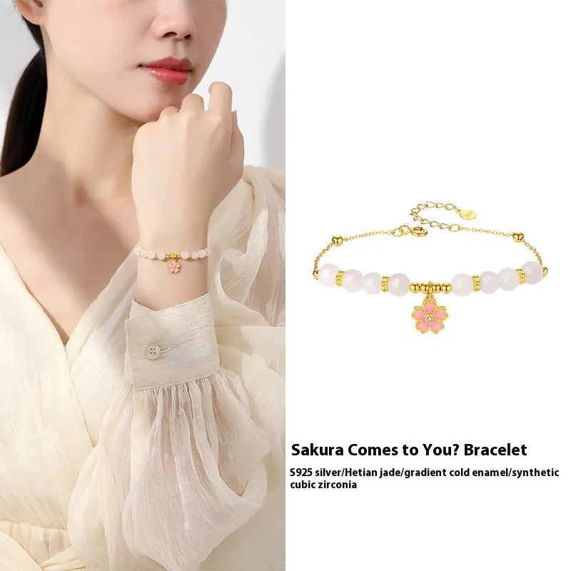 Pink women's bracelet with 925 silver cherry blossom pendant, Hetian jade beads, and gradient epoxy details.